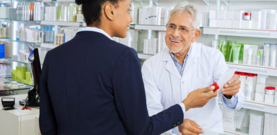 male pharmacist introducing a product to a woman