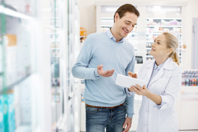 a pharmacist consulting a customer